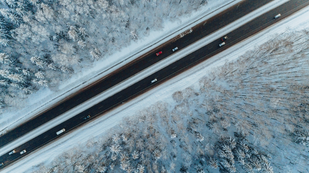 Unveiling the Veil of Temporary Imports. Ariel view of icy road.