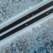 Unveiling the Veil of Temporary Imports. Ariel view of icy road.