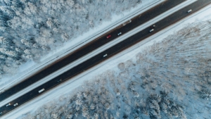 Unveiling the Veil of Temporary Imports. Ariel view of icy road.